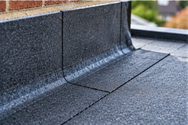 A felt flat roof with the covering torn back to the deck